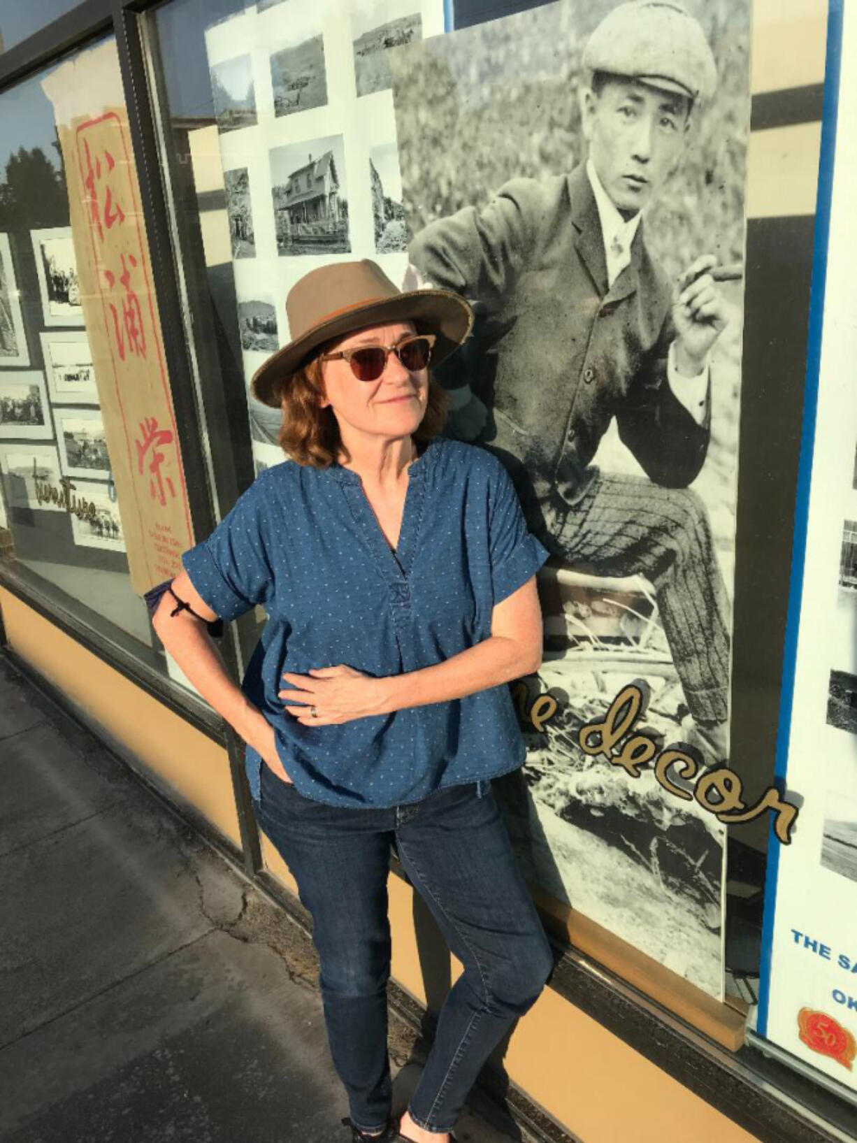 Vancouver filmmaker Beth Harrington is working on a documentary about Frank Matsura, pictured in the photo display next to her.