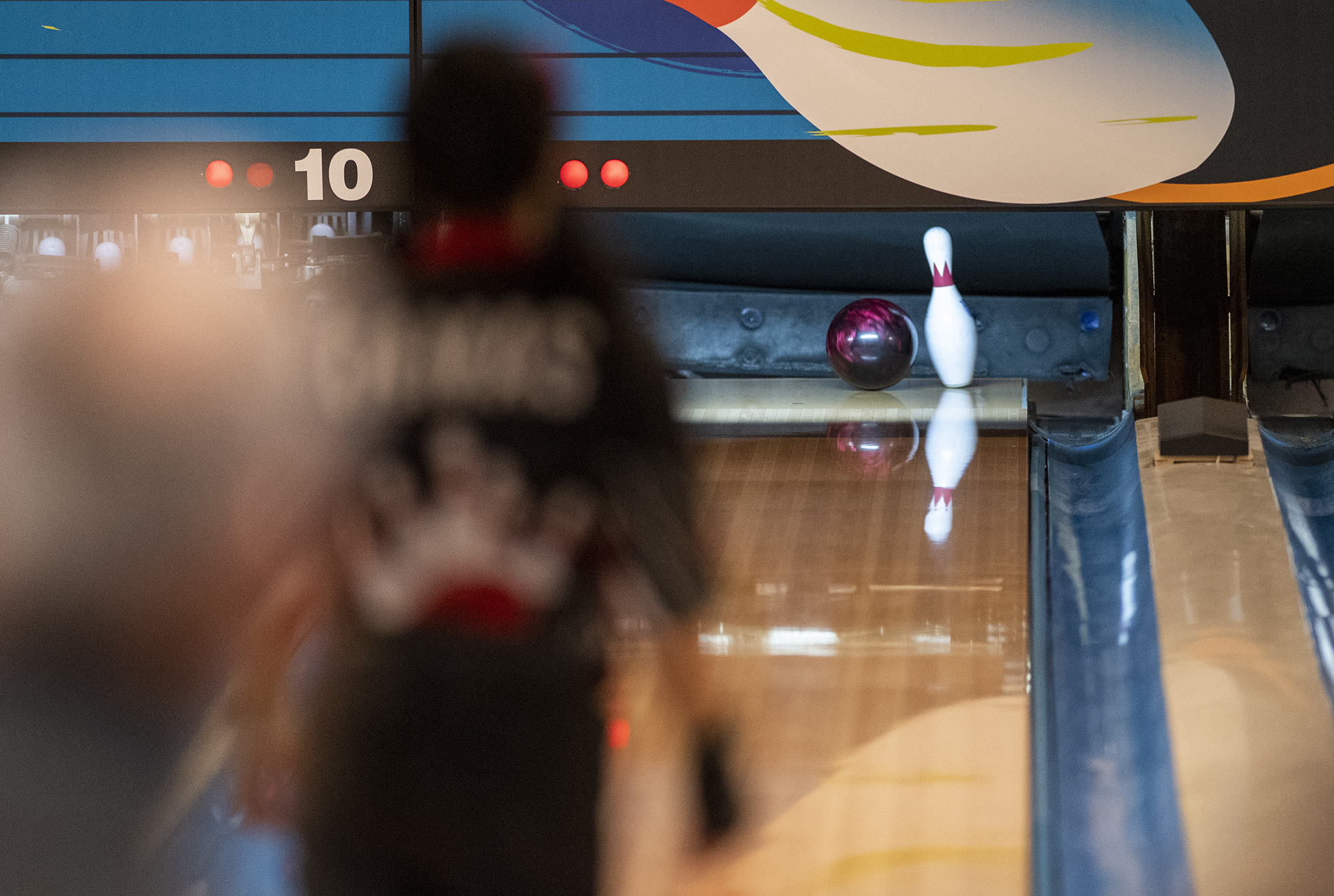 A Camas bowler watches as a ball grazes the final pin Friday, Jan. 27, 2023, during the 4A/3A District Bowling Tournament at Husted’s Hazel Dell Lanes.