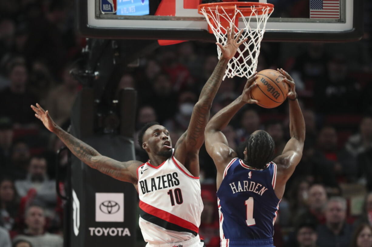 Portland Trail Blazers forward Nassir Little (10) tries to block a shot by Philadelphia 76ers guard James Harden (1) during the second half of an NBA basketball game in Portland, Ore., Thursday, Jan. 19, 2023.