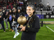 FILE - Portland Thorns FC forward Sophia Smith holds the MVP trophy after the NWSL championship soccer match against the Kansas City Current, Saturday, Oct. 29, 2022, in Washington. Forward Sophia Smith was named the U.S. Soccer Female Player of the Year on Friday, Jan.