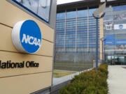 FILE - This is a March 12, 2020, file photo showing NCAA headquarters in Indianapolis. The NCAA and many of its student-athletes are closely watching a court case in Pennsylvania that could determine whether Division I athletes should be paid for their time in the same way students are paid for work-study jobs.