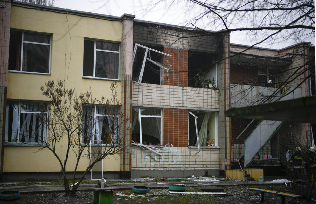 A view of the scene where a helicopter crashed on civil infrastructure in Brovary, on the outskirts of Kyiv, Ukraine, Wednesday, Jan. 18, 2023. The chief of Ukraine's National Police says a helicopter crash in a Kyiv suburb has killed 16 people, including Ukraine's interior minister and two children. He said nine of those killed were aboard the emergency services helicopter.