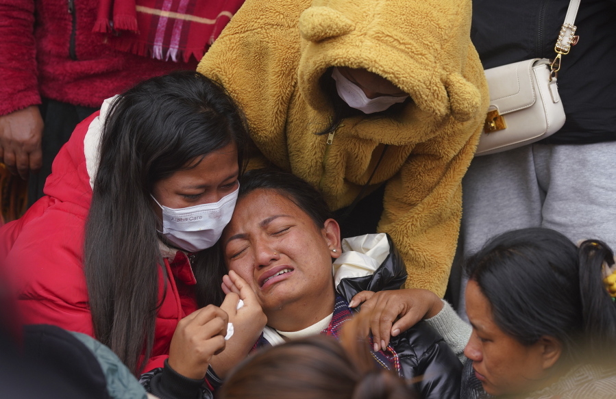 A woman wails as she waits to receive the body of a relative, victim of a plane crash, at a hospital in Pokhara, Nepal, Monday, Jan 16, 2023. Nepal began a national day of mourning Monday as rescue workers resumed the search for six missing people a day after a plane to a tourist town crashed into a gorge while attempting to land at a newly opened airport, killing at least 66 of the 72 people aboard in the country's deadliest airplane accident in three decades.