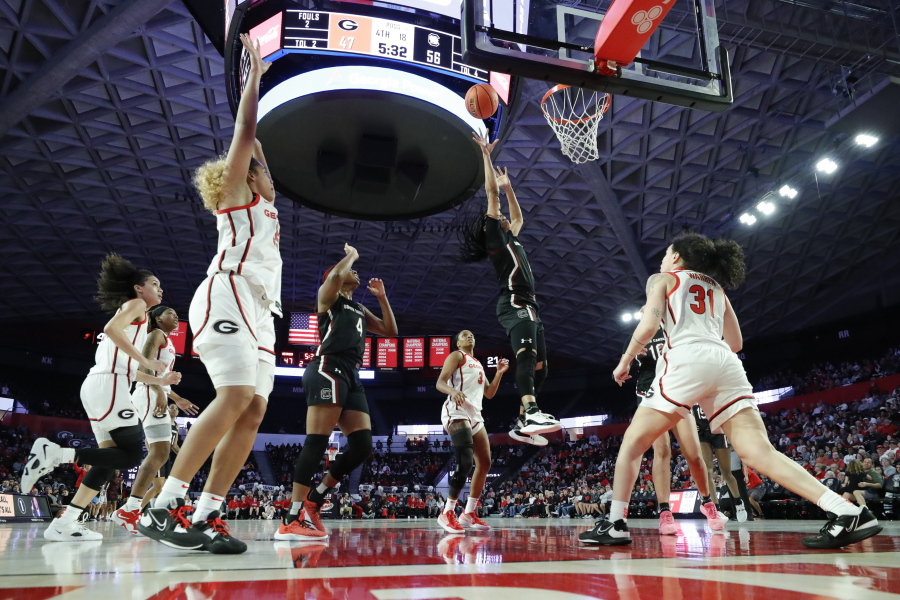 South Carolina guard Zia Cooke, second from right, shoots over Georgia guard Audrey Warren, right, during the second half of an NCAA college basketball game in Athens, Ga., Monday, Jan. 2, 2023.