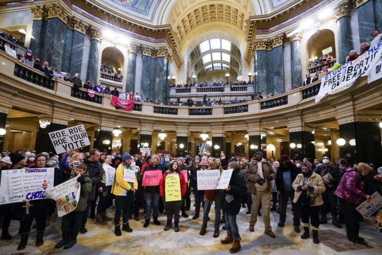 Protesters are seen in the Wisconsin Capitol Rotunda during a march supporting overturning Wisconsin's near total ban on abortion Sunday, Jan. 22, 2023, in Madison, Wis.