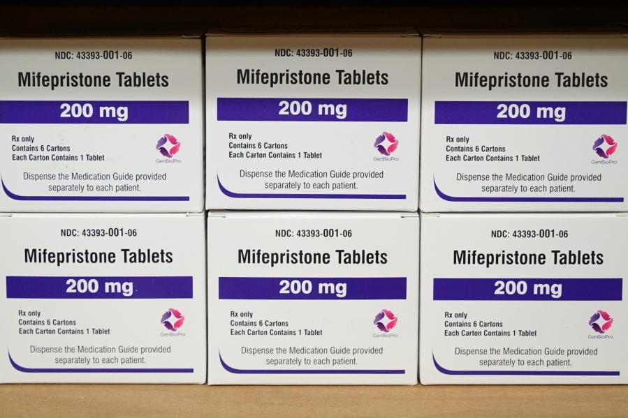FILE - Boxes of the drug mifepristone sit on a shelf at the West Alabama Women's Center in Tuscaloosa, Ala., on March 16, 2022. Lawsuits have been filed in West Virginia and North Carolina challenging the states' restrictions on the use of abortion pills. (AP Photo/Allen G.