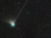 This photo provided by Dan Bartlett shows comet C/2022 E3 (ZTF) on Dec. 19, 2022. It last visited during Neanderthal times, according to NASA. It is expected to come within 26 million miles (42 million kilometers) of Earth on Feb. 1, 2023, before speeding away again, unlikely to return for millions of years.