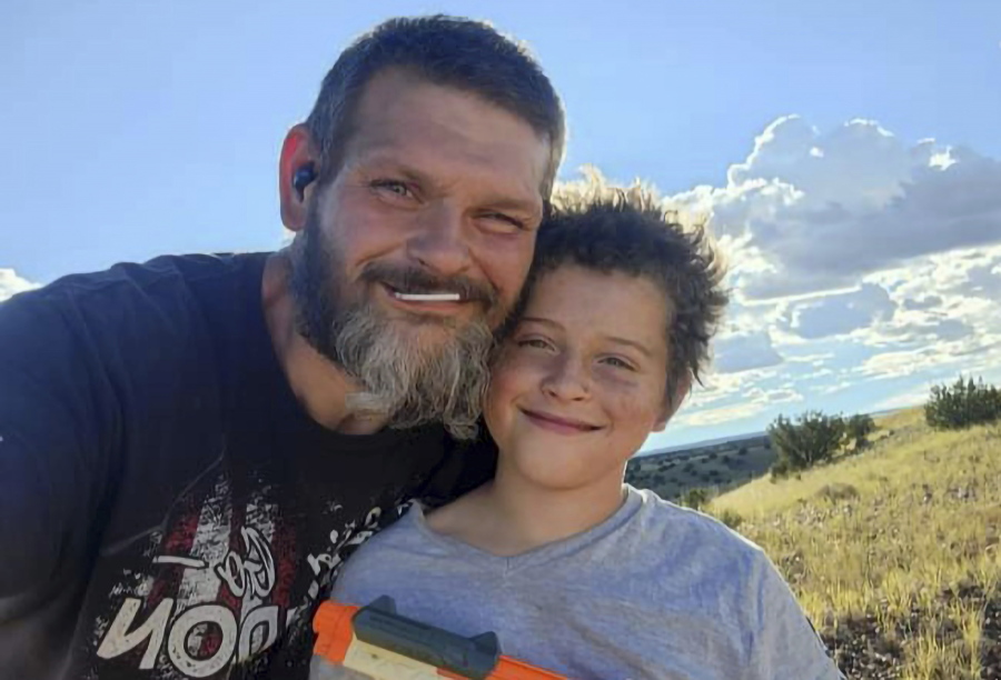 This 2022 photo provided by Richard Blodgett shows Blodgett and his son, Jakob. Blodgett was arrested in December, and Jakob was placed in a foster home under the Arizona Department of Child Safety where he developed complications from diabetes and died.