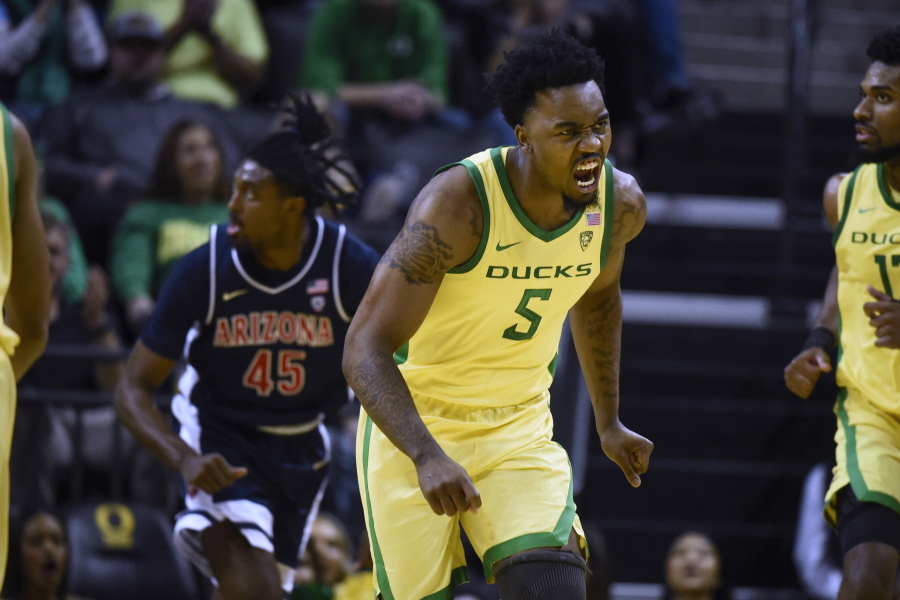 Oregon guard Jermaine Couisnard (5) reacts after making a shot against against Arizona during the second half of an NCAA college basketball game Saturday, Jan. 14, 2023, in Eugene, Ore.