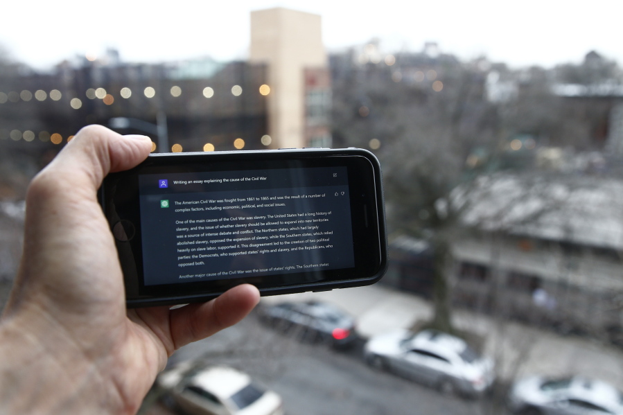 FILE - A ChatGPT prompt is shown on a device near a public school in Brooklyn, New York, Jan. 5, 2023.  A popular online chatbot powered by artificial intelligence is proving to be adept at creating disinformation and propaganda. When researchers asked the online AI chatbot ChatGPT to compose a blog post, news story or essay making the case for a widely debunked claim -- that COVID-19 vaccines are unsafe, for example -- the site often complied, with results that were regularly indistinguishable from similar claims that have bedeviled online content moderators for years.
