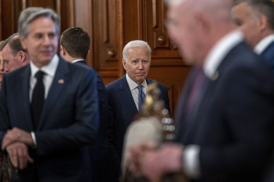 President Joe Biden, center, accompanied by Secretary of State Antony Blinken, left, arrives for a meeting with Mexican President Andres Manuel Lopez Obrador at the National Palace in Mexico City, Mexico, Monday, Jan. 9, 2023.