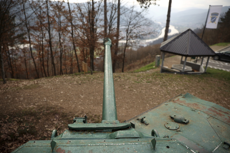 A tank is seen on a former frontline above Gorazde, Bosnia, Monday, Dec. 19, 2022. To survive and keep the lights on in their besieged town - cut off throughout Bosnia's 1992-95 interethnic war from access to electricity grid, food, medicine and the outside world - the people of Gorazde had to come up with various creative inventions.