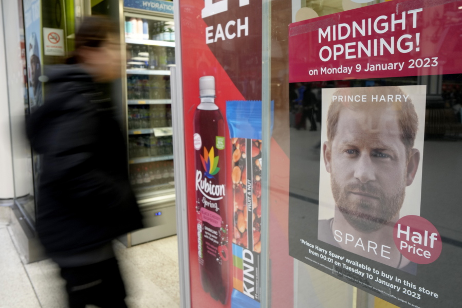 A poster advertises the midnight opening of a store to sell the new book by Prince Harry called 'Spare' in London, Monday, Jan. 9, 2023. Prince Harry has defended his memoir that lays bare rifts inside Britain's royal family. He says in TV interviews broadcast Sunday that he wanted to "own my story" after 38 years of "spin and distortion" by others. Harry's soul-baring new memoir, "Spare," has generated incendiary headlines even before its release.