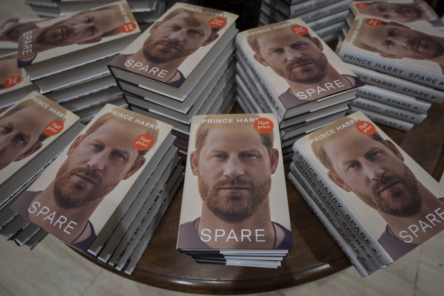 FILE - Copies of the new book by Prince Harry called "Spare" are displayed at a book store in London, Jan. 10, 2023. Prince Harry's explosive memoir, with its damning allegations of a toxic relationship between the monarchy and the press, is likely to accelerate the pace of change already under way within the House of Windsor following the death of Queen Elizabeth II.