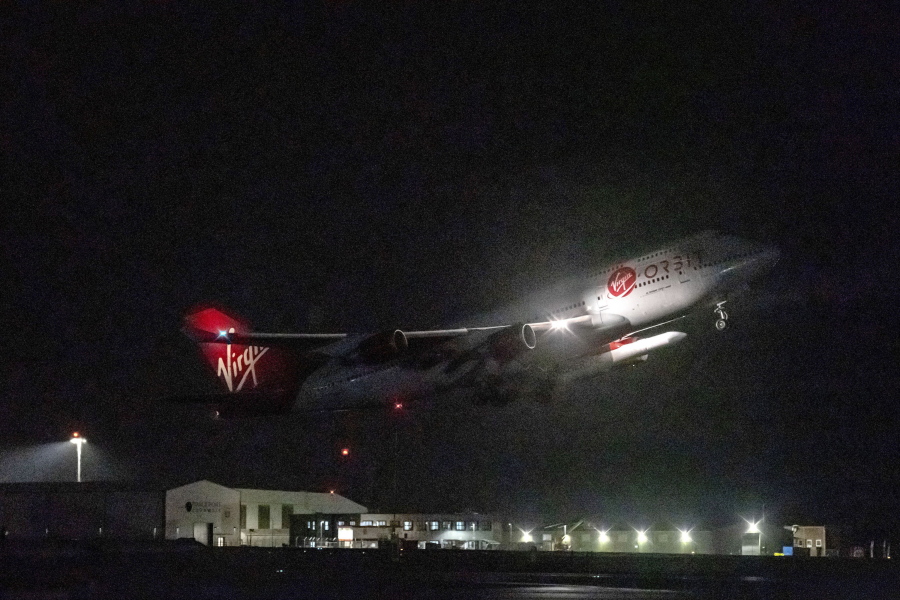 A repurposed Virgin Atlantic Boeing 747 aircraft, named Cosmic Girl, carrying Virgin Orbit's LauncherOne rocket, takes off from Spaceport Cornwall at Cornwall Airport, Newquay, England, Monday, Jan. 9, 2023. The plane will carry the rocket to 35,000 feet where it will be released over the Atlantic Ocean to the south of Ireland, as part of the Start Me Up mission and the first rocket launch from U.K. The rocket will take multiple small satellites, with a variety of civil and defence applications, into orbit.