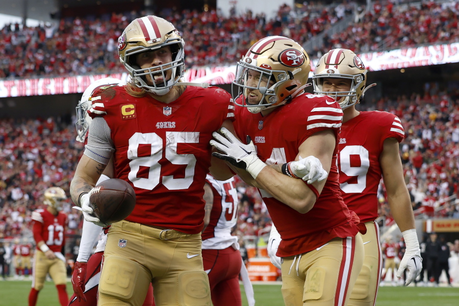 San Francisco 49ers tight end George Kittle (85) is congratulated by fullback Kyle Juszczyk after scoring against the Arizona Cardinals during the second half of an NFL football game in Santa Clara, Calif., Sunday, Jan. 8, 2023.