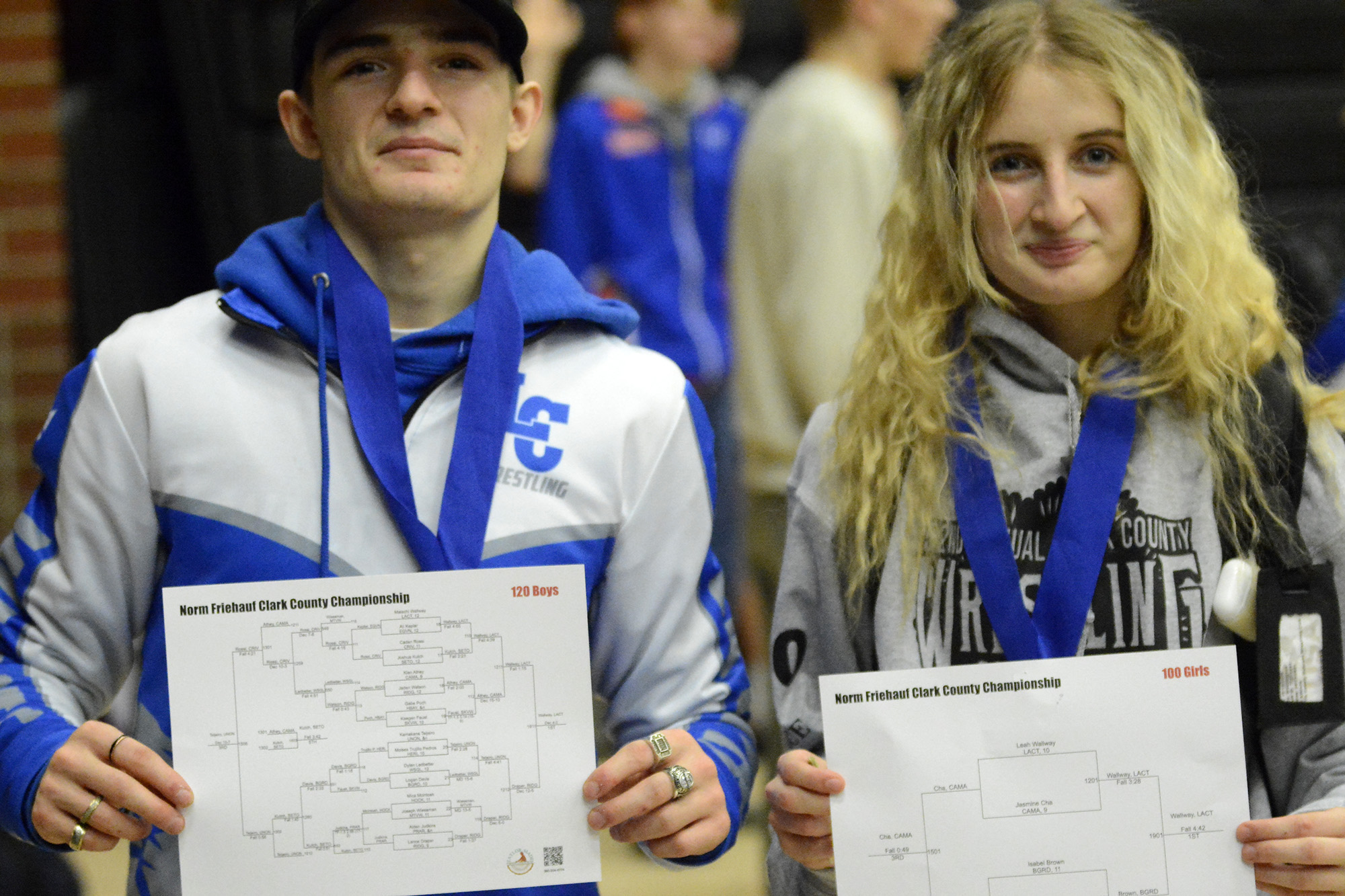 Malachi Wallway and Leah Wallway pose with their brackets after becoming the third brother-sister duo to win Clark County championships in the same year at the Clark County Wrestling Championships at Union High School on Saturday, Jan.