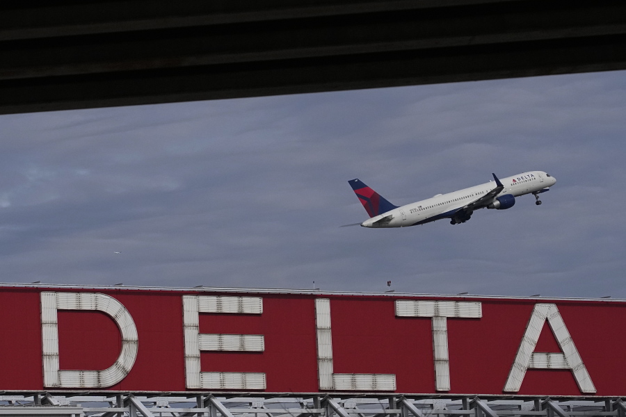 FILE - A Delta Air Lines plane takes off from Hartsfield-Jackson Atlanta International Airport in Atlanta, Nov. 22, 2022. Delta announced Thursday, Jan. 5, 2023, that it will provide free Wi-Fi service on most of its U.S. flights starting in February.