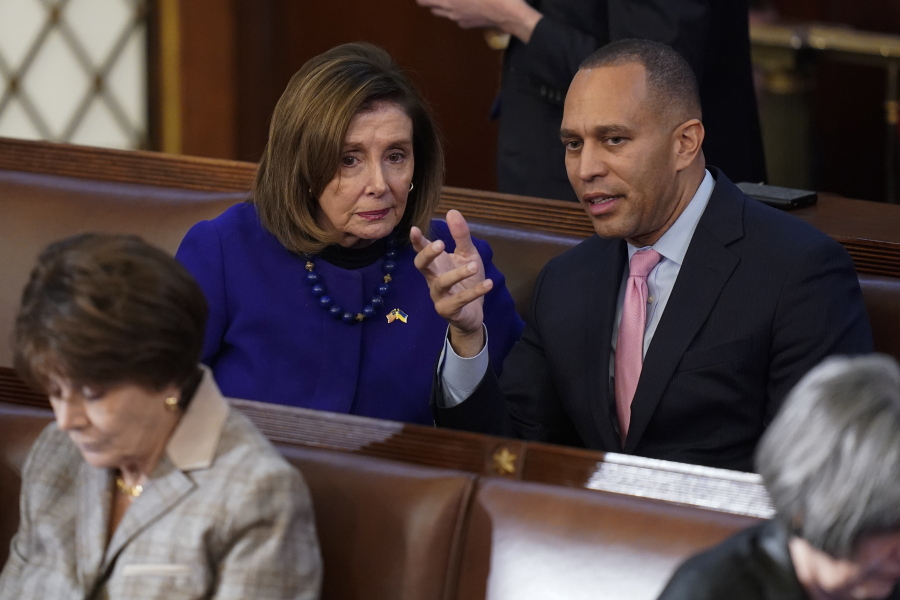 FILE - Rep. Hakeem Jeffries, D-N.Y., right, talks with Rep. Nancy Pelosi, D-Calif., during the eighth vote in the House chamber as the House meets for the third day to elect a speaker and convene the 118th Congress in Washington, on Jan. 5, 2023. Democrats are basking in having displayed remarkable unity, with every one of their members backing party leader Hakeem Jeffries for the House speakership again and again and again. Speculation Biden might have to overcome a hard Democratic primary has also quieted.