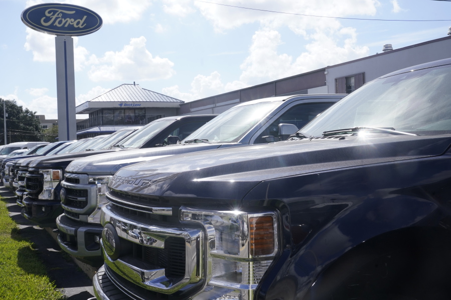 Ford F150 trucks are displayed at a Gus Machado dealership Monday, Jan. 23, 2023, in Hialeah, Fla. On Thursday, the Commerce Department issues its first of three estimates of how the U.S.