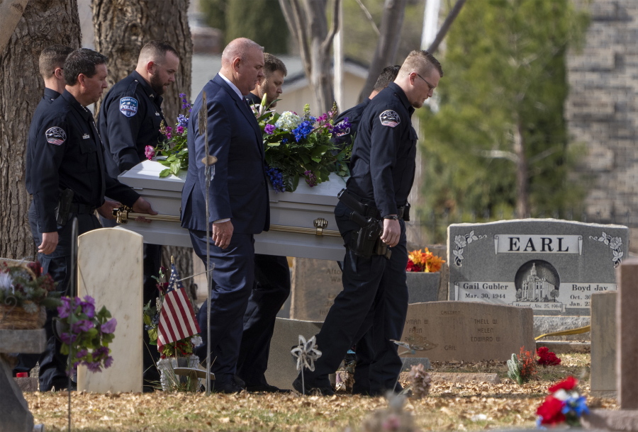 FILE - Pallbearers carry a casket to the graveside service for the Haight and Earl families in La Verkin, Utah, on Jan. 13, 2023, in La Verkin, Utah. A Utah man who killed seven family members before committing suicide earlier this month had been investigated for child abuse years prior. Police records obtained by The Associated Press shed light on Michael Haight's violent tendencies and the warning signs that authorities were aware of years before the tragic murder-suicide.