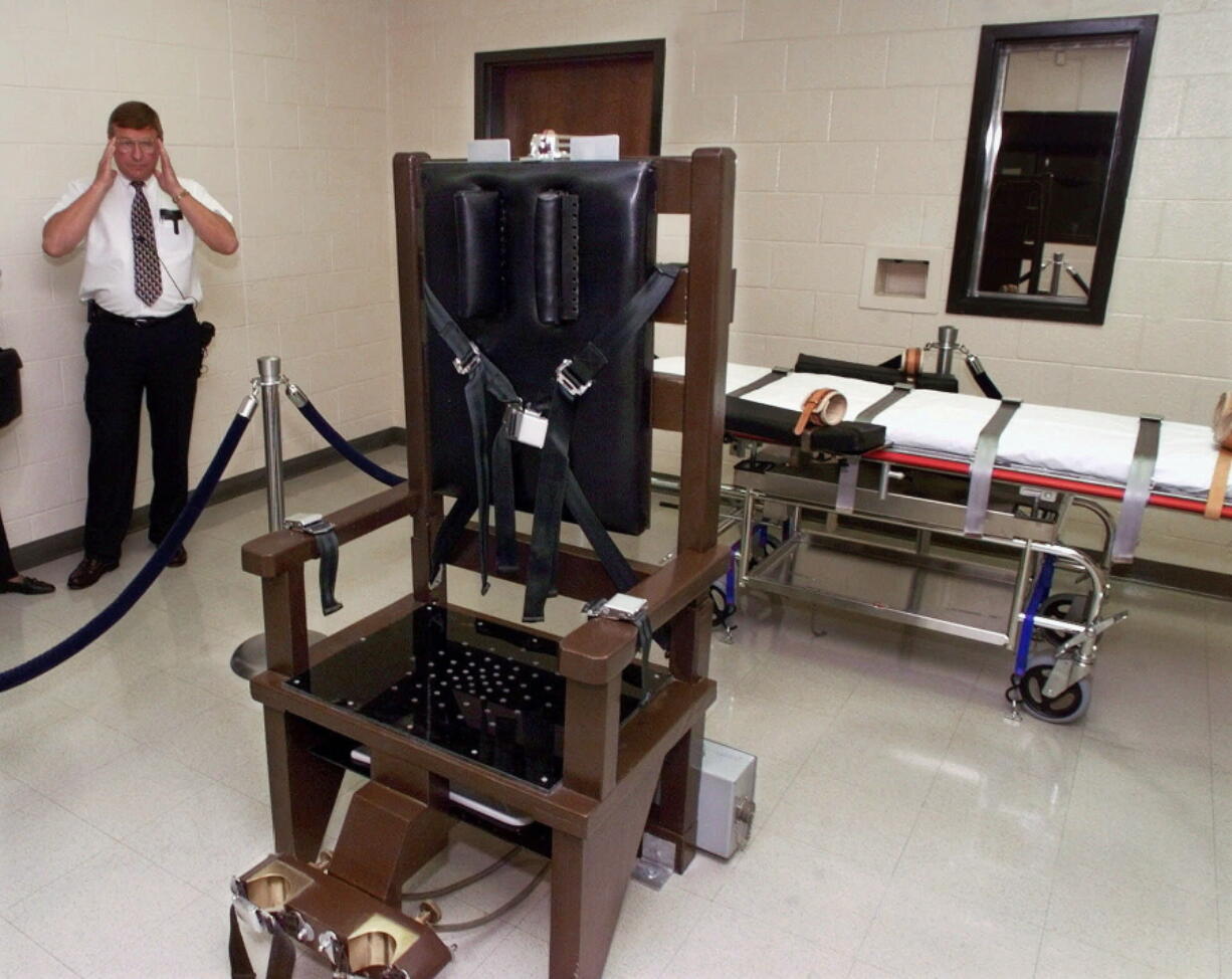 FILE - Ricky Bell, warden at Riverbend Maximum Security Institution in Nashville, Tenn., gives a tour of the prison's execution chamber, Oct. 13, 1999. The Tennessee Department of Correction has fired its longtime top attorney and another employee following an independent report on failures within the state's lethal injection system. Debbie Inglis, the deputy commissioner and general counsel, and Kelly Young, the inspector general, received notices of "expiration of your executive service appointment" on Dec. 27, 2022, according to documents obtained by The Associated Press through public records requests.
