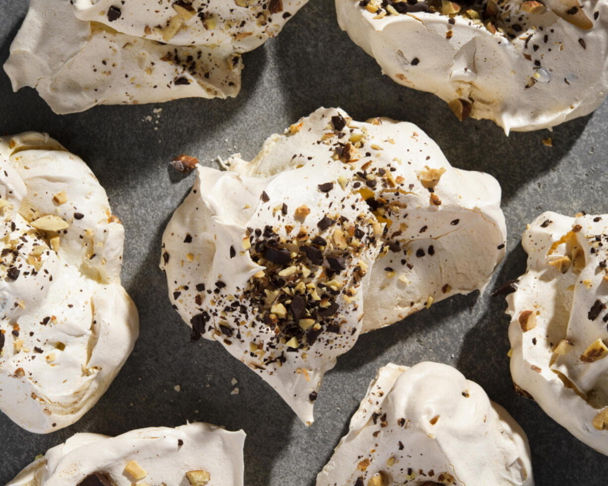 A recipe for meringue cookies topped with salted peanuts and chocolate (Milk Street)