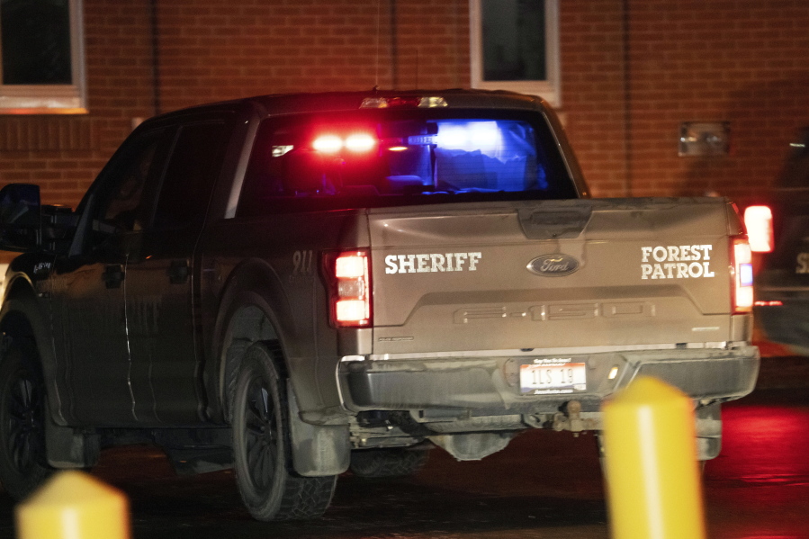 The truck with with paper blocking some of its windows and believed to be transporting Bryan Kohberger, who is accused of killing four University of Idaho students in November 2022, arrives in a police motorcade at the Latah County Courthouse, Wednesday, Jan. 4, 2023, in Moscow, Idaho, following Kohberger's extradition from Pennsylvania. (AP Photo/Ted S.