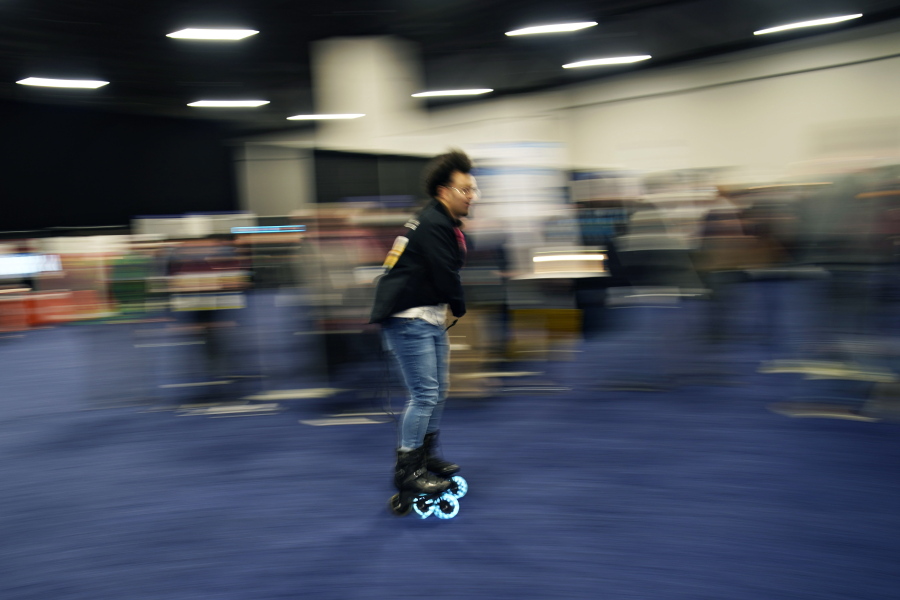 Mohamed Soliman of Atmos Gear shows off the Atmos Gear inline electric skates during CES Unveiled before the start of the CES tech show, Tuesday, Jan. 3, 2023, in Las Vegas.
