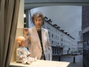 Holocaust survivor Lore Mayerfeld poses next to her doll Inge as part of an exhibition with items from Israel's Yad Vashem Holocaust memorial in the German parliament Bundestag in Berlin, Germany on Monday.