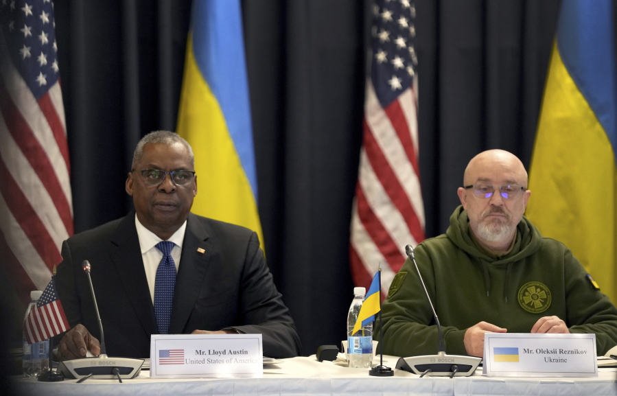 US Defense Secretary Lloyd Austin, left, and the Ukrainian participant Oleksii Reznikov, right, attend the meeting of the 'Ukraine Defense Contact Group' at Ramstein Air Base in Ramstein, Germany, Friday, Jan. 20, 2023.