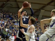 Gonzaga guard Julian Strawther, left, hits a shot over Portland forward Moses Wood, right, during the first half of an NCAA college basketball game in Portland, Ore., Saturday, Jan. 28, 2023.