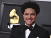 FILE - Trevor Noah appears at the 63rd annual Grammy Awards in Los Angeles on March 14, 2021. Noah is hosting the Grammy Awards for a third-straight year.
