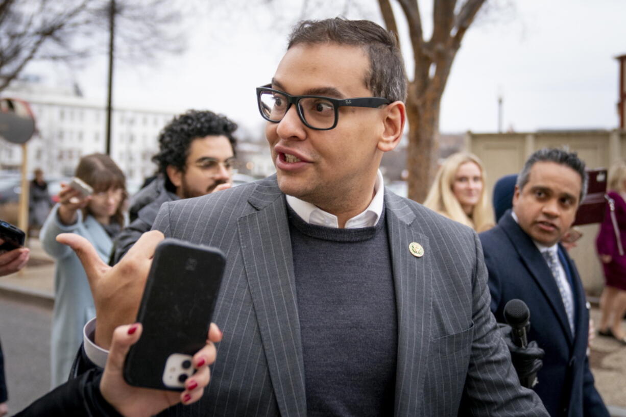 FILE - Rep. George Santos, R-N.Y., leaves a House GOP conference meeting on Capitol Hill in Washington, Jan. 25, 2023. Santos told Republican colleagues in a closed-door meeting Tuesday he won't serve on his two committees for now, GOP lawmakers say.