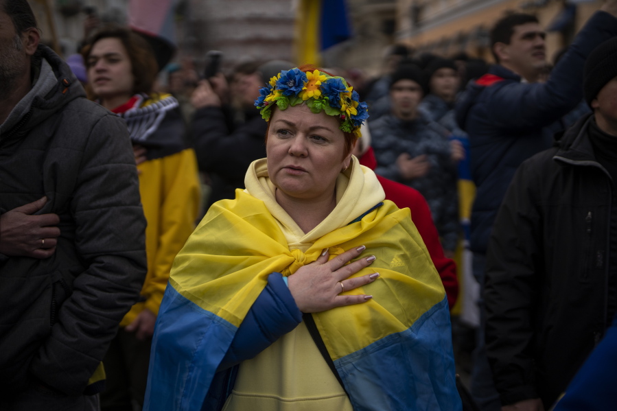FILE - Demonstrators sing the national anthem during a protest in Odessa, Ukraine, Sunday, Feb. 20, 2022. The widespread resolve against Russia's invasion of Ukraine demonstrates the power of a unified response against human rights abuses, a leading watchdog group said Thursday, Jan. 12, 2023, and comes amid growing dissatisfaction with autocratic regimes, with protests in Iran, China and elsewhere.