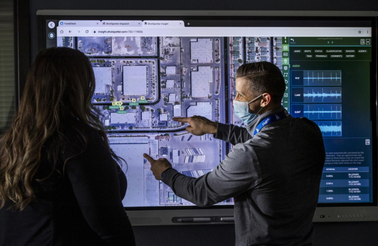 FILE - Law enforcement personnel use an interactive electronic map for the ShotSpotter Dispatch program running within the Fusion Watch department at the Las Vegas Metropolitan Police Headquarters Wednesday, Jan. 13, 2021, in Las Vegas. In more than 140 cities across the United States in 2023, ShotSpotter's artificial intelligence algorithm and its intricate network of microphones evaluate hundreds of thousands of sounds a year to determine if they are gunfire, generating data now being used in criminal cases nationwide. (L.E.