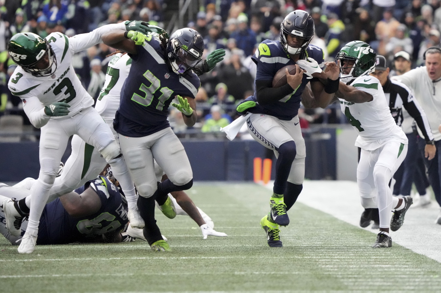 Seahawks keep playoff hopes alive with win, eliminate Jets - The