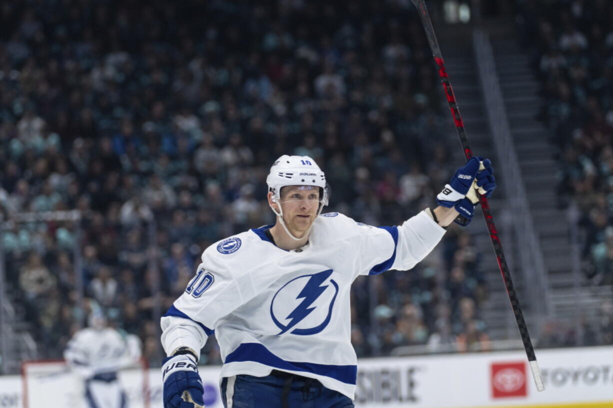 Tampa Bay Lightning forward Corey Perry celebrates after scoring a goal during the first period of an NHL hockey game against the Seattle Kraken, Monday, Jan. 16, 2023, in Seattle.