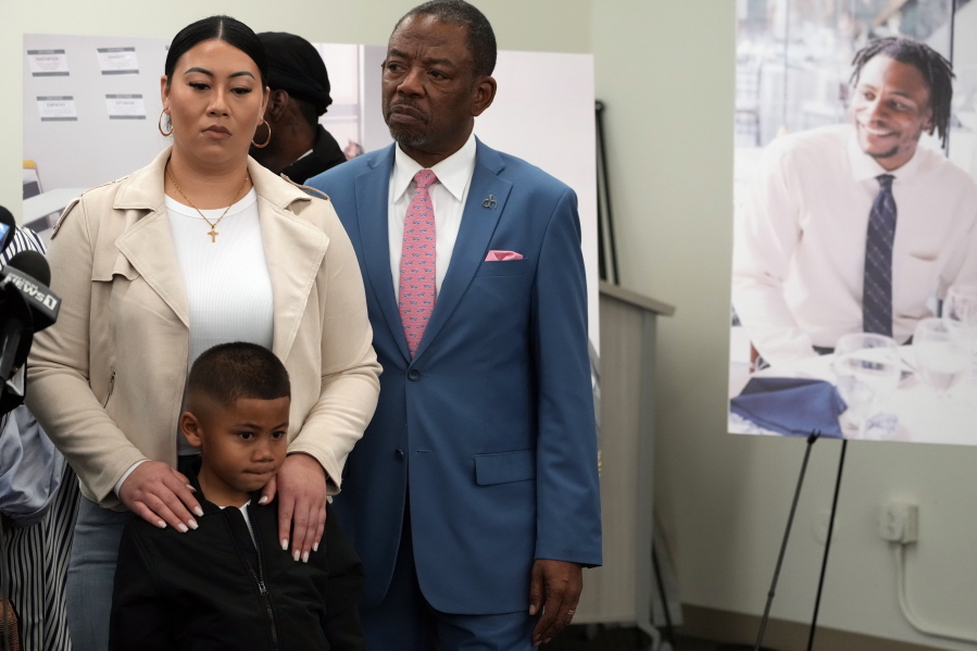 Lawyer Carl Douglas, right, holds a news conference with Gabrielle Hansel, guardian of five-year-old Syncere Kai Anderson, to announce filing a $50 million in damages claim against the city of Los Angeles over the death of Keenan Anderson, seen photo right, at a news conference in Los Angeles Friday, Jan. 20, 2023.
