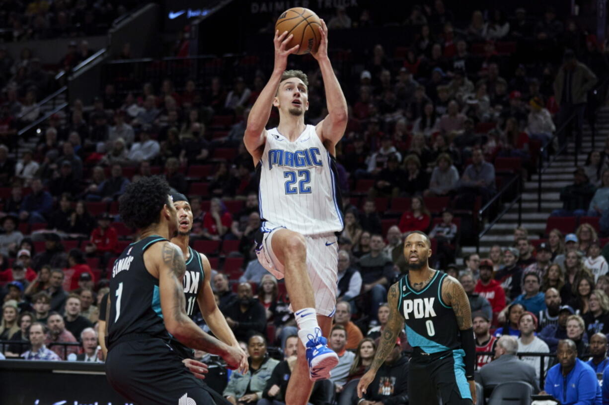 Orlando Magic forward Franz Wagner (22) shoots against the Portland Trail Blazers during the first half of an NBA basketball game in Portland, Ore., Tuesday, Jan. 10, 2023.