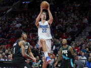 Orlando Magic forward Franz Wagner (22) shoots against the Portland Trail Blazers during the first half of an NBA basketball game in Portland, Ore., Tuesday, Jan. 10, 2023.