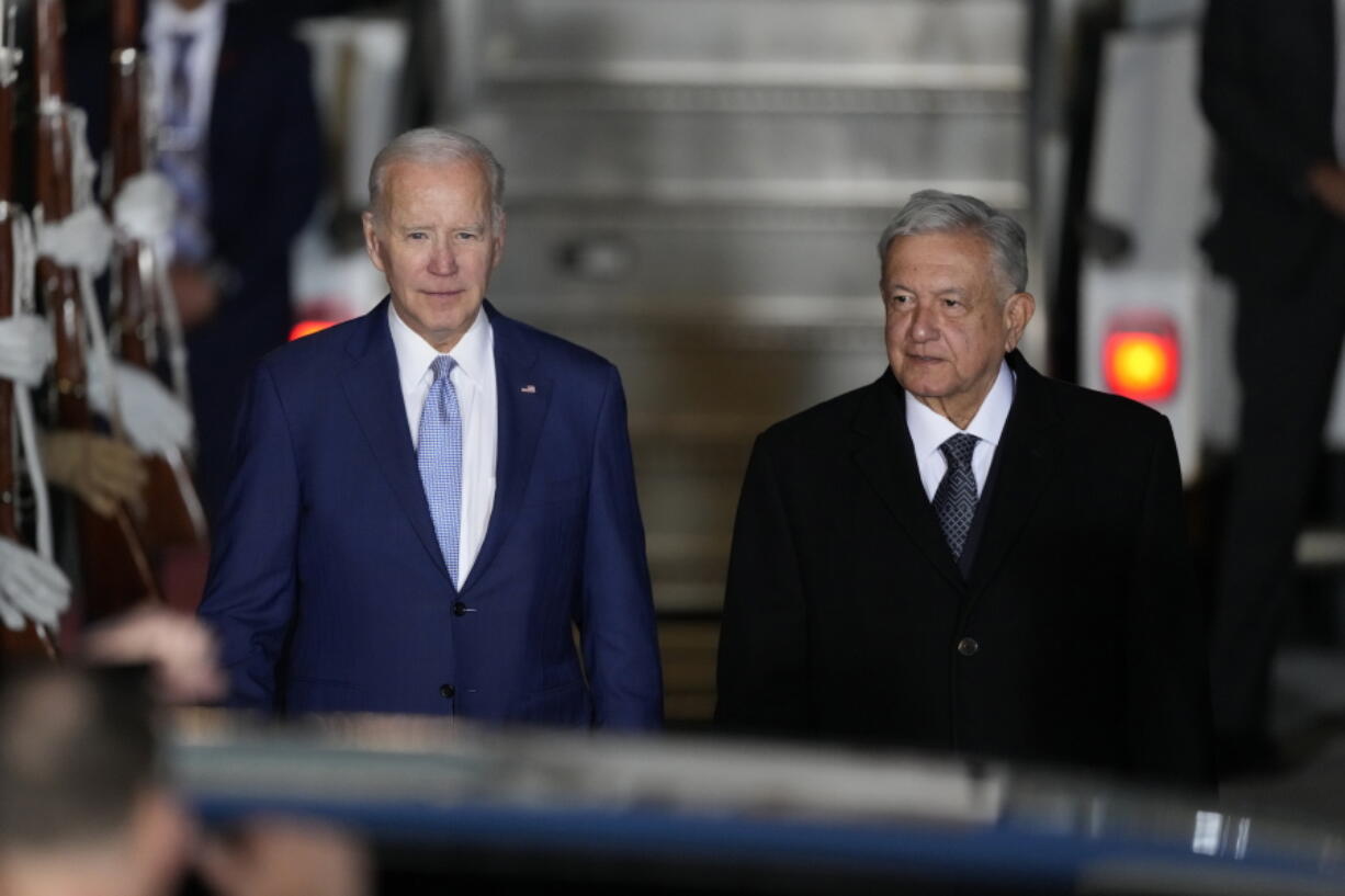 U.S. President Joe Biden walks with Mexican President Andres Manuel Lopez Obrador, at his arrival to the Felipe Angeles international airport in Zumpango, Mexico, Sunday, Jan. 8, 2023.