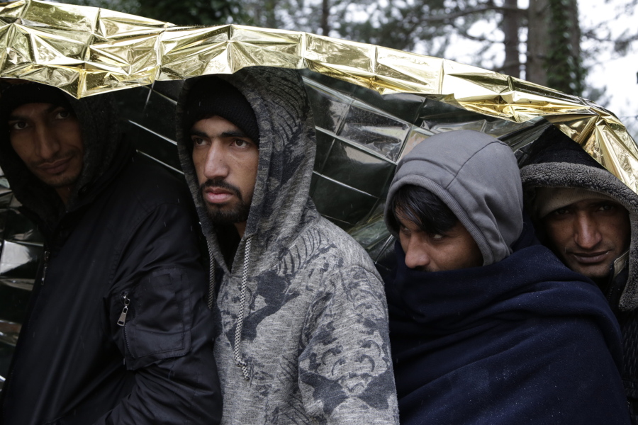 FILE - Migrants wait for food distribution in Bihac, Bosnia, close to the border to Croatia on Nov. 28, 2018. The number of attempts by migrants to enter the European Union without authorization reached around 330,000 last year, the highest number since 2016, the EU's border and coast guard agency said Friday, Jan. 13, 2023.
