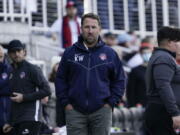 FILE - Washington Spirit head coach Kris Ward, center, stands pitch side during the second half of the NWSL Championship soccer match against the Chicago Red Stars, Saturday, Nov. 20, 2021, in Louisville, Ky. The National Women's Soccer League said abuse allegations against former Washington Spirit coach Kris Ward were substantiated and he is ineligible to work in the NWSL without the commissioner's approval.