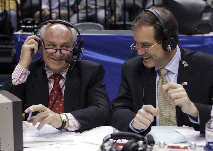 CBS announcers Billy Packer, left, and Jim Nantz laugh during a break in the championship game in the Big Ten basketball tournament in Indianapolis, March 12, 2006. Packer, an Emmy award-winning college basketball broadcaster who covered 34 Final Fours for NBC and CBS, died Thursday night, Jan. 26, 2023, of kidney failure. He was 82.