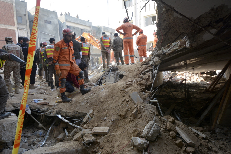 Rescue workers conduct an operation to clear the rubble and search for bodies at the site of Monday's suicide bombing, in Peshawar, Pakistan, Tuesday, Jan. 31, 2023. The death toll from the previous day's suicide bombing at a mosque in northwestern Pakistani rose to more than 85 on Tuesday, officials said. The assault on a Sunni Mosque inside a major police facility was one of the deadliest attacks on Pakistani security forces in recent years.