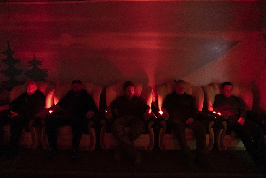 Ukrainian soldiers undergo laser therapy at a rehabilitation center in Kharkiv region, Ukraine, Friday, Dec. 30, 2022. The relentless 10-month war has prompted a local commander to transform an old soviet-era sanatorium into a recovery center for servicemen to treat both mental and physical ailments.