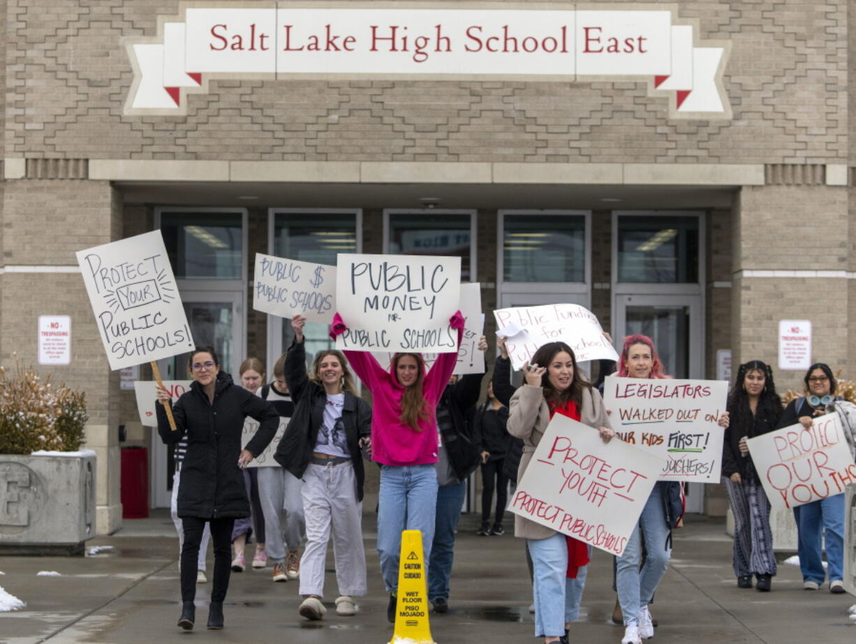 Students and teachers from East High School in Salt Lake City walk out of school to protest the HB15 voucher bill, on Wednesday, Jan. 25, 2023. Several years of pandemic restrictions and curriculum battles have emboldened longtime advocates of funneling public funds to private and religious schools in statehouses throughout the country.