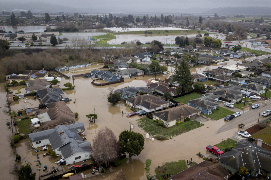 Flooding from huge amounts of rain are seen in a neighborhood off of Holohan Road near Watsonville, Calif. on Monday, Jan. 9, 2023.(Bront?