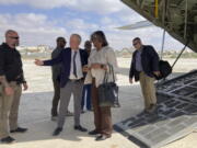 The U.S. ambassador to the United Nations, Linda Thomas-Greenfield, center, is welcomed by U.S. ambassador to Somalia Larry Andre, center left, on her arrival in Mogadishu, Somalia Sunday, Jan. 29, 2023. The first U.S.